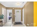 Bright foyer features neutral walls and a view to the bedroom at 181 Mott Rd, Mooresville, NC 28115
