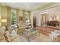 Cozy living room with hardwood floors, natural light, and access to dining room at 2129 Halford Pl, Charlotte, NC 28211