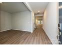 Entryway with wood-look floors leading to bright rooms, neutral wall color, and ample natural light at 2155 Sunflower Cir, Newton, NC 28658