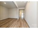 Open-concept living room with hardwood floors and plenty of natural light at 2159 Sunflower Cir, Newton, NC 28658
