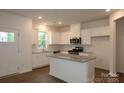 Bright, white kitchen featuring stainless steel appliances and granite countertops at 3156 Lilac Grove Dr, Charlotte, NC 28269