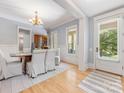 Bright dining room with hardwood floors and elegant decor at 3825 Mountain Cove Dr, Charlotte, NC 28216