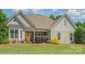 Lovely home with charming curb appeal and a welcoming front door at 6603 Havencrest Dr, Denver, NC 28037