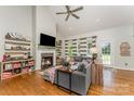 Bright living room with fireplace, vaulted ceiling, hardwood floors, and lots of natural light at 6603 Havencrest Dr, Denver, NC 28037