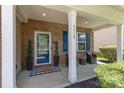 Inviting front porch featuring cozy seating, decorative plants, and a stylish entrance at 7318 Agnew Dr, Charlotte, NC 28278