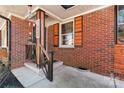 Inviting brick porch showcasing wood trim and a welcoming entrance with custom wood accents at 851 Gist Rd, Rock Hill, SC 29732