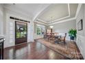 Elegant dining room with hardwood floors, tray ceiling, and ample natural light at 9075 Blue Ridge Dr, Indian Land, SC 29707