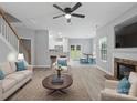 Open-concept living area boasts sleek floors, a fireplace, and seamless transitions to the kitchen and dining spaces at 908 Sundance Dr, Gastonia, NC 28054