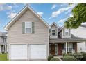 Charming home featuring a two-car garage, manicured lawn, and inviting front porch at 108 Copes Ct, Rock Hill, SC 29732