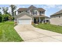 Attractive two-story home boasting a two-car garage, a welcoming front porch, and well-kept landscaping at 11109 Amur Ct, Charlotte, NC 28262