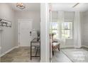 Welcoming entryway featuring wood floors, a console table, and a glimpse into the living room at 1121 Freeman View Dr, Albemarle, NC 28001