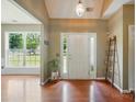 Bright foyer with hardwood floors and views of a green front yard at 14402 Asheton Creek Dr, Charlotte, NC 28273