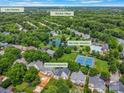 Beautiful aerial view of the neighborhood, showcasing lush greenery and community amenities at 14426 Harvington Dr, Huntersville, NC 28078