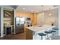 Bright kitchen features stainless appliances, quartz countertops and wine storage at 210 N Church St # 2613, Charlotte, NC 28202