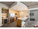 Modern kitchen features stainless appliances, quartz countertops and wine storage at 210 N Church St # 2613, Charlotte, NC 28202