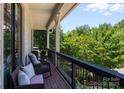 Relaxing balcony featuring wicker furniture and beautiful outdoor views, perfect for enjoying the scenery at 2925 Westfield Rd, Charlotte, NC 28209
