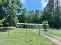 A cozy single-story house featuring a fenced front yard, providing security and a touch of classic charm at 341 Austin Dr, York, SC 29745