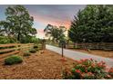 Private gated entrance with brick pillars, tasteful landscaping, and a well-maintained driveway at 3440 17Th Ne Ave, Hickory, NC 28601