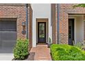 Charming front entrance with brick walkway, black door, and manicured landscaping; number 4030 displayed at 4030 City Homes Pl, Charlotte, NC 28209
