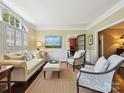 Cozy living room with neutral tones, ample natural light, and elegant furnishings at 4608 Morrowick Rd, Charlotte, NC 28226