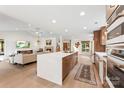 Open kitchen and living room, with large island and modern appliances at 50 Honeysuckle Woods, Lake Wylie, SC 29710
