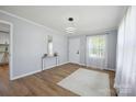 Inviting living room with wood floors, modern lighting, and neutral decor at 502 Kings Mountain St, Clover, SC 29710