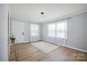 Well-lit living room with a bright rug, hardwood floors, and modern lighting at 502 Kings Mountain St, Clover, SC 29710