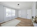 Bright living room featuring hardwood floors, modern lighting and natural light at 502 Kings Mountain St, Clover, SC 29710