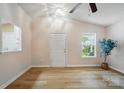Bright and airy living room featuring new flooring, vaulted ceiling, and ample natural light at 1162 Willet Dr, Rock Hill, SC 29732