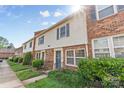 A row of townhouses featuring brick and siding exteriors and manicured lawns at 1228 Archdale Dr # H, Charlotte, NC 28217