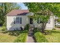 Inviting single-story home featuring a well-manicured lawn and a charming walkway leading to the front door at 1302 N Ellis St, Salisbury, NC 28144