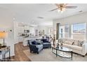 Open-concept living room with modern decor, a large window offering lots of natural light and seamless access to the kitchen at 14015 Wilson Mac Ln, Charlotte, NC 28278