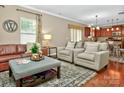 Inviting living room with hardwood floors, neutral paint, and comfortable seating arrangement at 14837 Dungannon Ct, Charlotte, NC 28278