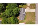 An aerial view of a well-maintained home with mature landscaping, a driveway, and a fully fenced backyard at 1657 6Th Se St, Hickory, NC 28602
