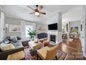 Bright living room featuring a fireplace, hardwood floors, and neutral decor at 1713 Allen St, Charlotte, NC 28205
