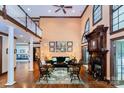 Spacious living room boasting soaring ceilings, fireplace, and floor-to-ceiling windows at 1720 Mills Harris Rd, Wingate, NC 28174
