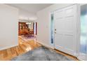 Bright foyer with hardwood floors leading to dining room at 17501 Youngblood Rd, Charlotte, NC 28278
