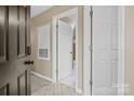 Hallway features multiple doors and neutral wall paint at 18669 Vineyard Point Ln, Cornelius, NC 28031