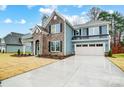 Beautiful two-story home with a two-car garage and spacious driveway, blending style and functionality at 2011 Cedar Falls Dr # 71, Waxhaw, NC 28173