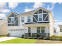 Charming home featuring craftsman architecture, stone accents, and lush green lawn at 2021 Boynton St, Charlotte, NC 28269