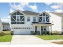 Inviting two-story home with a two-car garage, craftsman architecture, and manicured lawn at 2021 Boynton St, Charlotte, NC 28269
