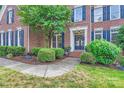 Charming front entrance with a landscaped walkway and wreath-adorned door at 2215 Maycroft Dr, Charlotte, NC 28262