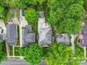 Aerial view of a home featuring a well-manicured yard and mature trees at 226 Union S St, Concord, NC 28025