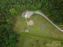 Overhead aerial view shows home's location, gravel drive, and outdoor spaces at 2609 Cove Creek Dr, Gastonia, NC 28056