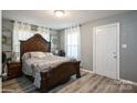 Cozy bedroom featuring a decorative headboard and natural light at 303 Island Ford Rd, Maiden, NC 28650
