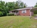 Quaint single-story brick home with a covered carport and partially covered porch at 3750 Turner Rd, Clover, SC 29710