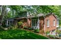 Charming brick and siding home with a well-maintained lawn and mature trees, offering a classic and inviting curb appeal at 4647 16Th Street Ne Pl, Hickory, NC 28601