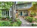 Inviting home featuring a brick facade, a welcoming front porch, and lush landscaping, creating a warm and inviting atmosphere at 4647 16Th Street Ne Pl, Hickory, NC 28601