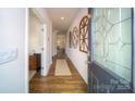 Inviting entryway featuring hardwood floors, decorative wall art, and a stained-glass front door at 545 Stroupe Rd, Gastonia, NC 28056