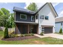 Attractive two-story home features modern siding, solar panels, and well-maintained landscaping at 5777 Stephanie St, Charlotte, NC 28212